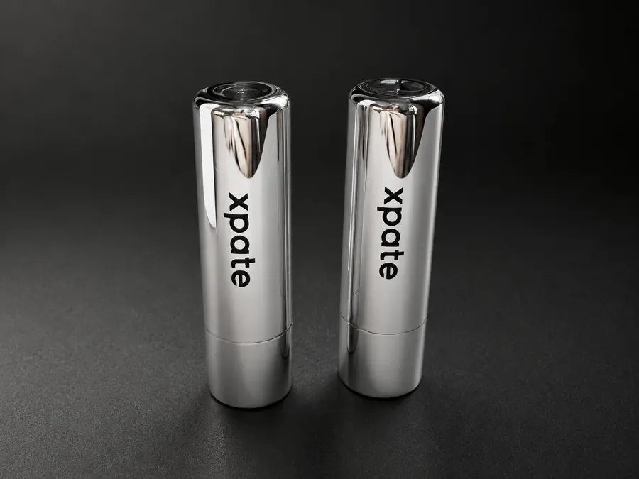Branded lip balm products on a dark background
