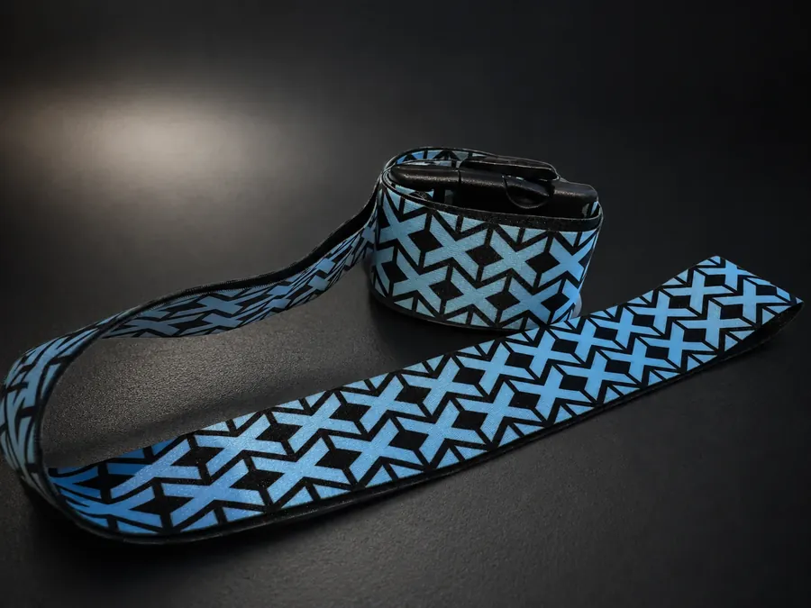 Custom printed textile belt on a dark background